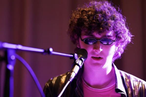 Vocalist singing into a microphone
