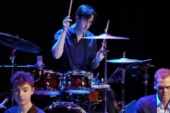 Drummer mid-song on stage